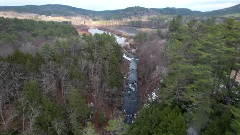 Qttauquechee-River-flowing-through-the-Quechee-Gorge-in-Vermont's-Mill-Pond-Falls---aerial-flyover