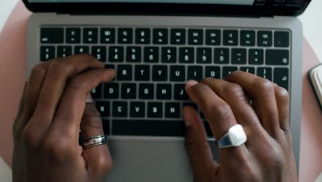 person typing on laptop keyboard