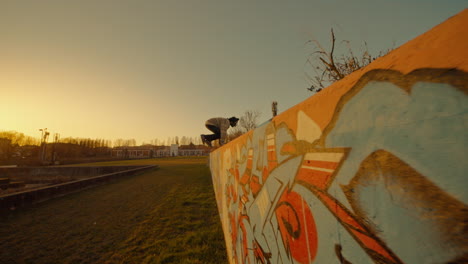 parkour at sunset with graffiti