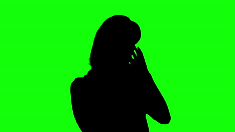 silhouette of woman enjoying music on green screen