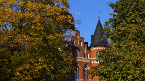 Swedish-Pennant-Flag-Waving-With-The-Wind-On-Top-Of-Kviberg-Military-Barracks-In-Gothenburg,-Sweden