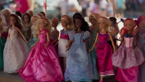 a collection of barbie dolls in various gowns