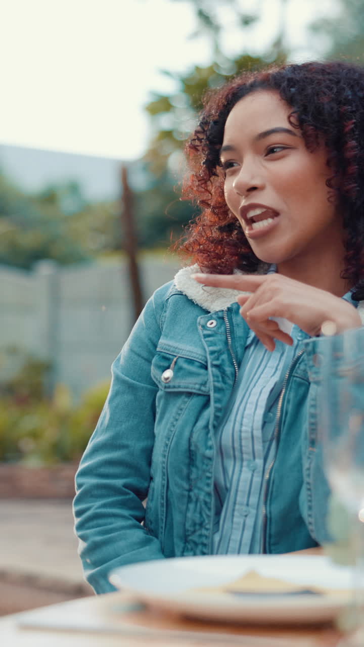Happy Young Woman Talking and Gesturing During Outdoor Conversation