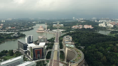 Aerial-push-in-shot-of-Perdana-Putra-in-Malaysia,-lightning-by-horizon