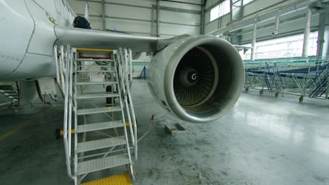 airplane engine maintenance in a hangar