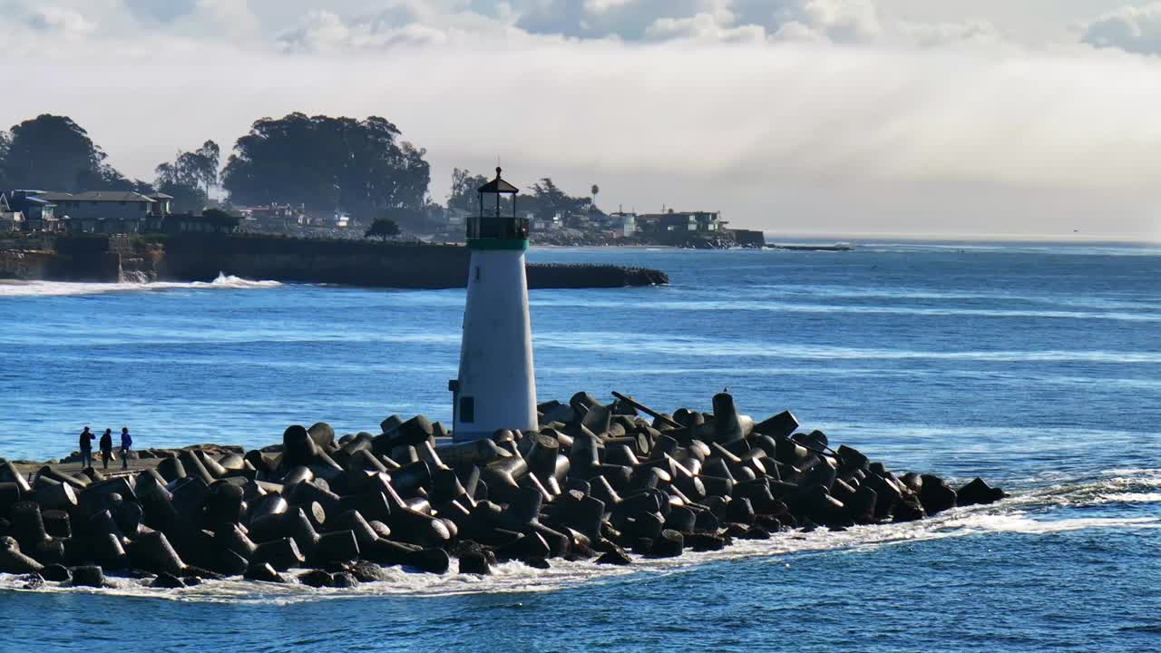 Walton Lighthouse Santa Cruz California USA aerial drone scenic landscape deep blue Monterey Bay Pacific Ocean seagull pelican birds marina harbor waves jetty walk morning bluesky mist fog static shot