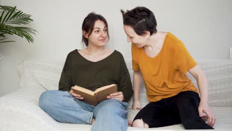 lesbian couple reading a book