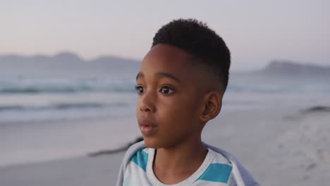 Portrait-of-happy-african-american-boy-on-sunny-beach