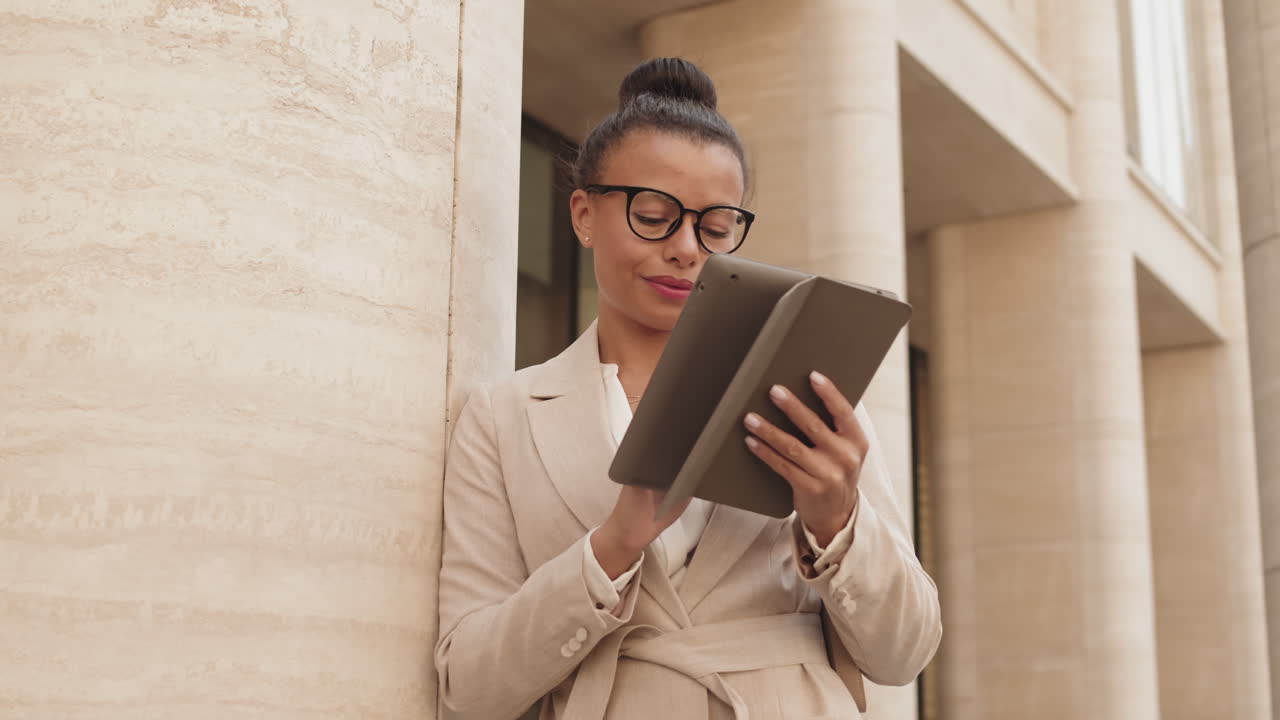 Businesswoman Using Digital Tablet in City Downtown