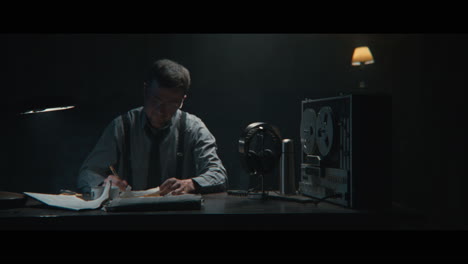 an intelligence officer sits down to the wiretap station