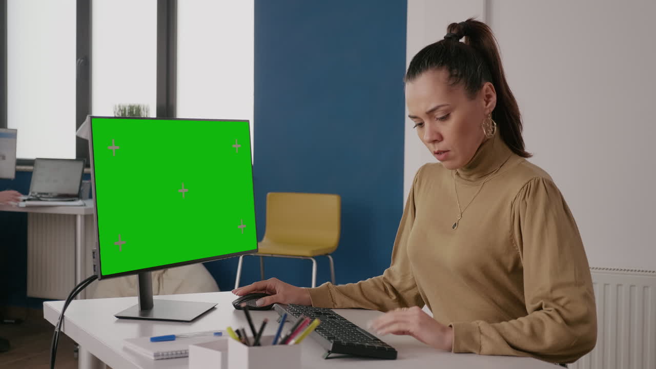 Company worker using green screen on computer