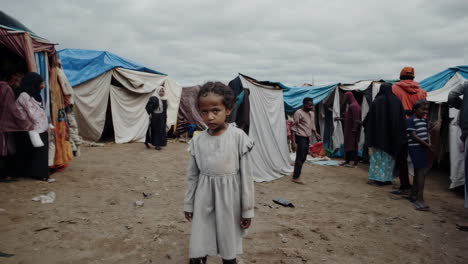 close-up portrait of a young child in a refugee camp