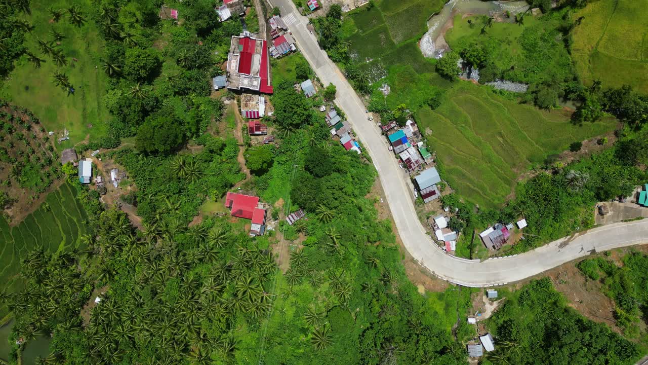 Above View Of Asphalt Road Through Rural Villages Near Tropical Mountains In Bato, Catanduanes, Philippines. Aerial Topdown Shot