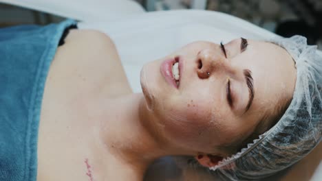 woman receiving facial treatment