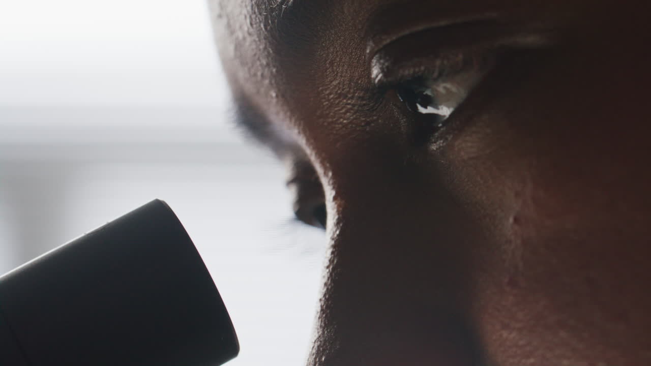 Eyes of Female Scientist Observing Microscopic Sample in Laboratory