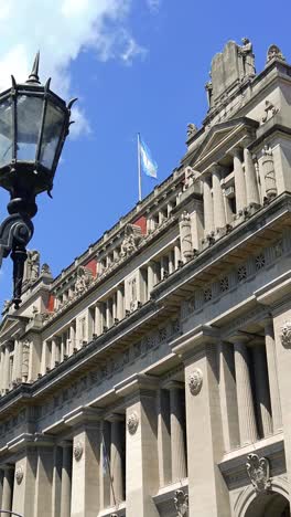 vertical argentina flag waves at skyline palace of justice building buenos aires city traditional landscape