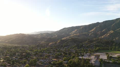 Beautiful-aerial-pan-view-of-the-mountains-and-town