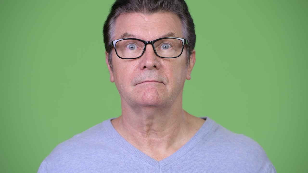 Senior handsome man doing three wise monkeys concept