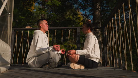 couple discovers unity in meditation rituals. partners embark on transformative vacation harmonizing relationship dynamics within peaceful ambiance of eco resort