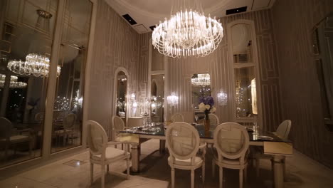 luxurious dining room with crystal chandelier and mirrored walls