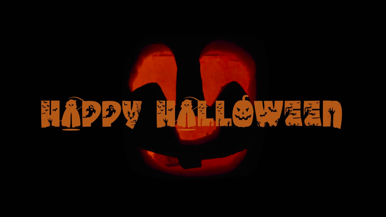 Happy Halloween Cute Jack O' Lantern glowing in the dark with Textanimation wishing Happy Halloween: carved Pumpkin decoration with burning candle inside.