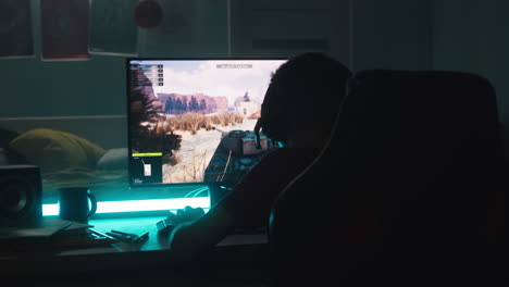 Teen Gamer Plays Tank Game in Bedroom at Night
