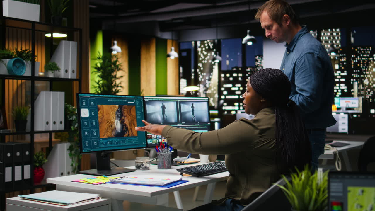 Professional video editing team works on film montage on software in office