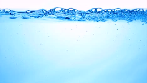 many bubbles in water close up, abstract water wave with bubbles in slow motion