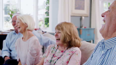 Group-Of-Senior-Friends-Relaxing-On-Sofa-At-Home