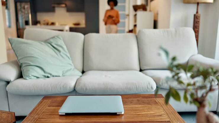 Black woman, laptop and movie streaming on sofa