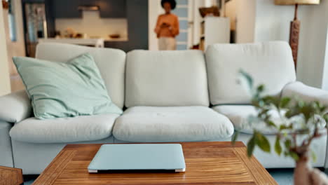 black woman, laptop and movie streaming on sofa