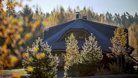 luxury forest lodge home lit by sunshine in early morning, time lapse