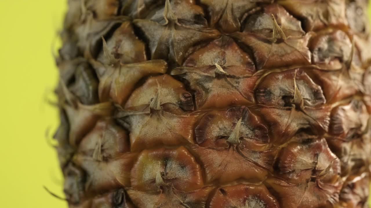 A macro shot of a spinning pineapple