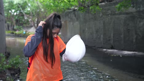 teenager in safety gear by a canal