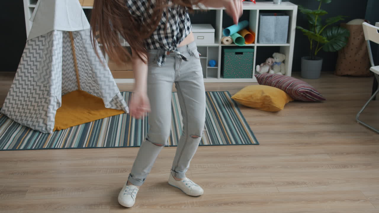 Teenage Girl Dancing in Kids Room with Headphones