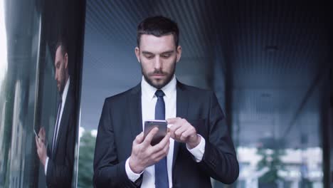 businessman using mobile phone outdoors