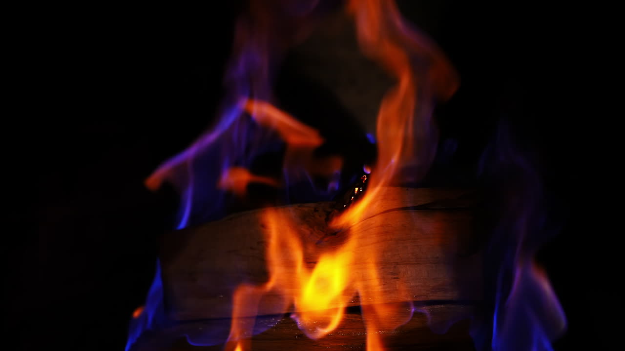 Fire flames in fireplace. Close up shot of warm cozy burning fire in brick fireplace