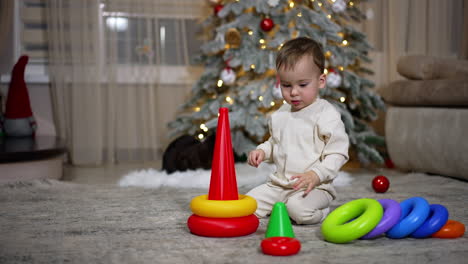baby playing with christmas toys