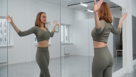 woman practicing dance in a studio