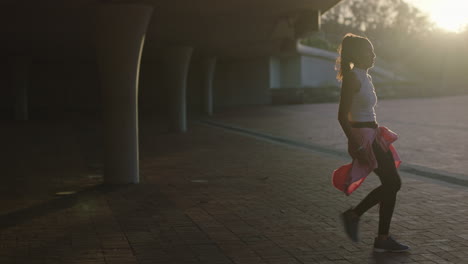 dancing woman young hispanic hip hop dancer in city enjoying fresh urban freestyle dance moves practicing expression at sunset