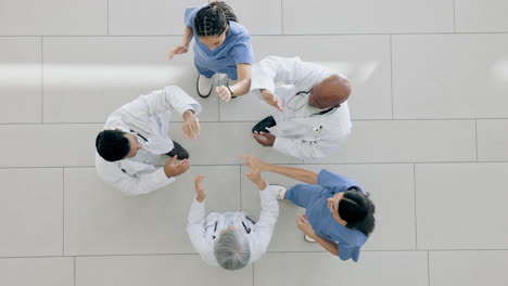 High-five,-happy-and-top-view-doctors