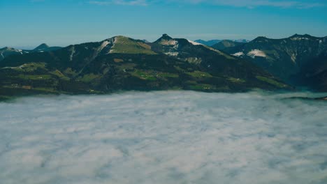 4k uhd time lapse cinemagraph of moving fog clouds bove austria and bavaria, seen from berchtesgaden 's famous rossfeld panorama road in winter