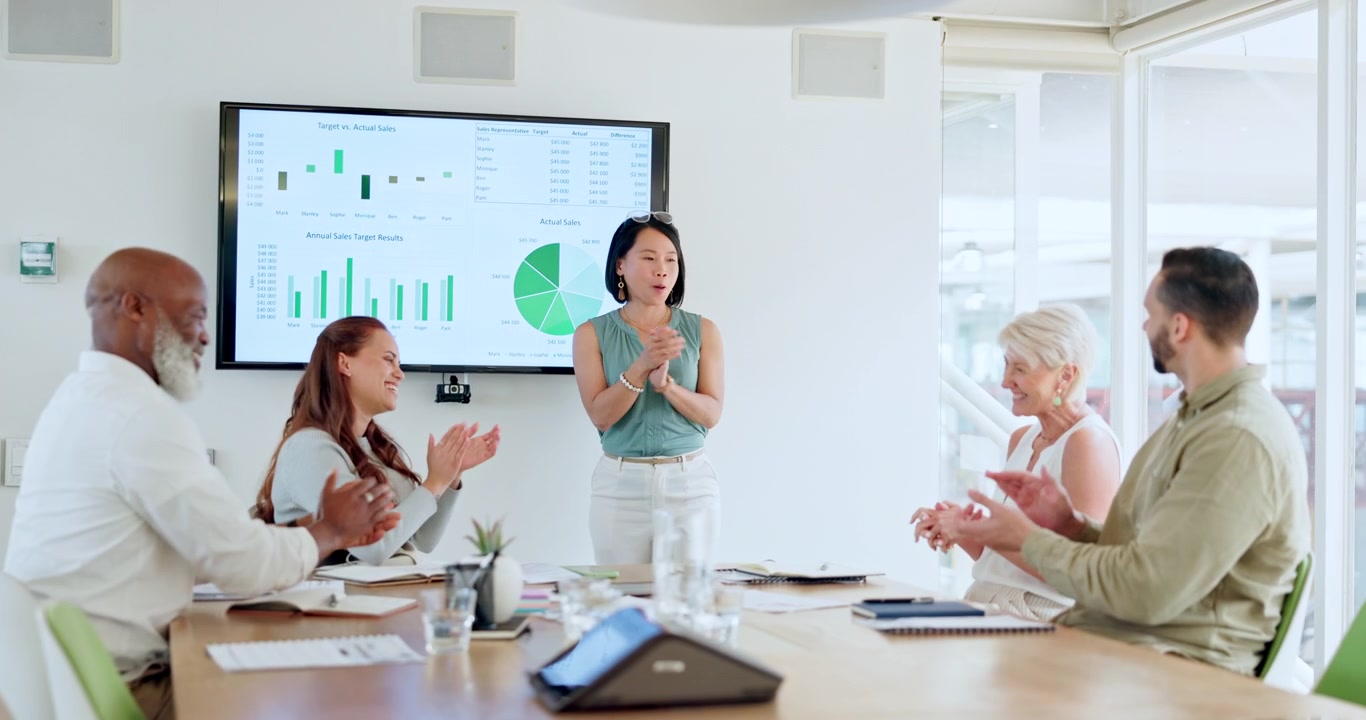 Diverse Business Team Applauding Colleague During Office Presentation