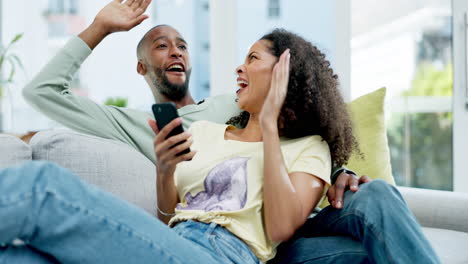 Happy-black-couple,-phone-and-celebration-on-sofa