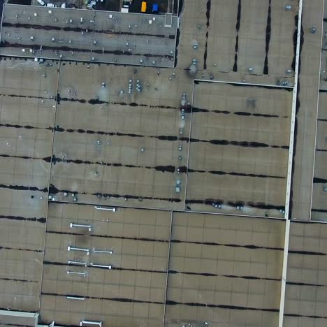 gray roofs of huge modern factory. view from above on industrial territory