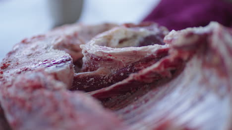 close up shot of raw lamb, handheld