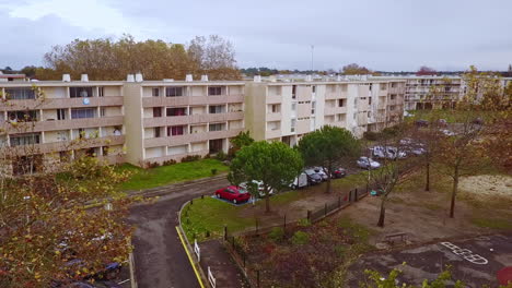 aerial shot pan right from small buildings to play park autumn biscarrosse, south france