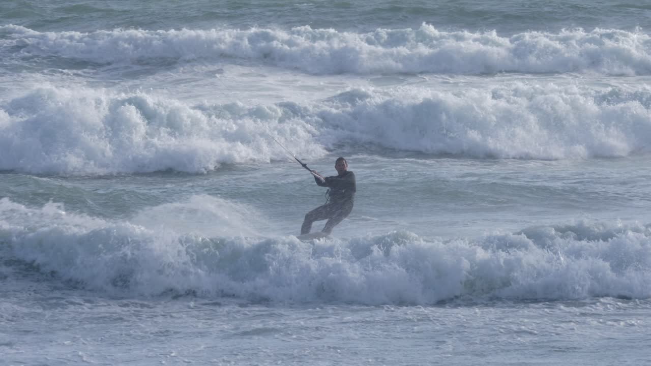 Kitesurfer Riding Waves in the Ocean