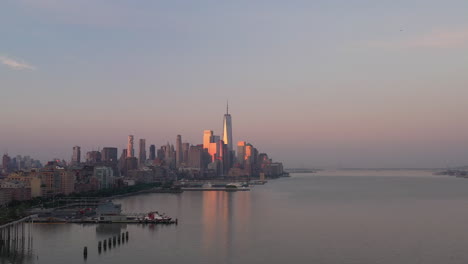 An-aerial-view-of-lower-Manhattan-and-New-Jersey-from-over-the-Hudson-River-at-sunrise