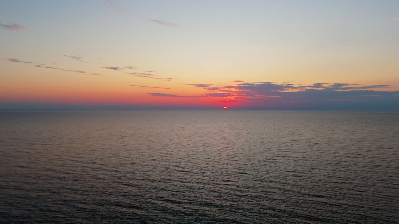 Drone Sunset View Over Uzava River Estuary Beach on the Baltic Sea Coast in Latvia Scenic Aerial Landscape Featuring Golden Light, Waves, Sand Dunes and Peaceful Coastal Atmosphere